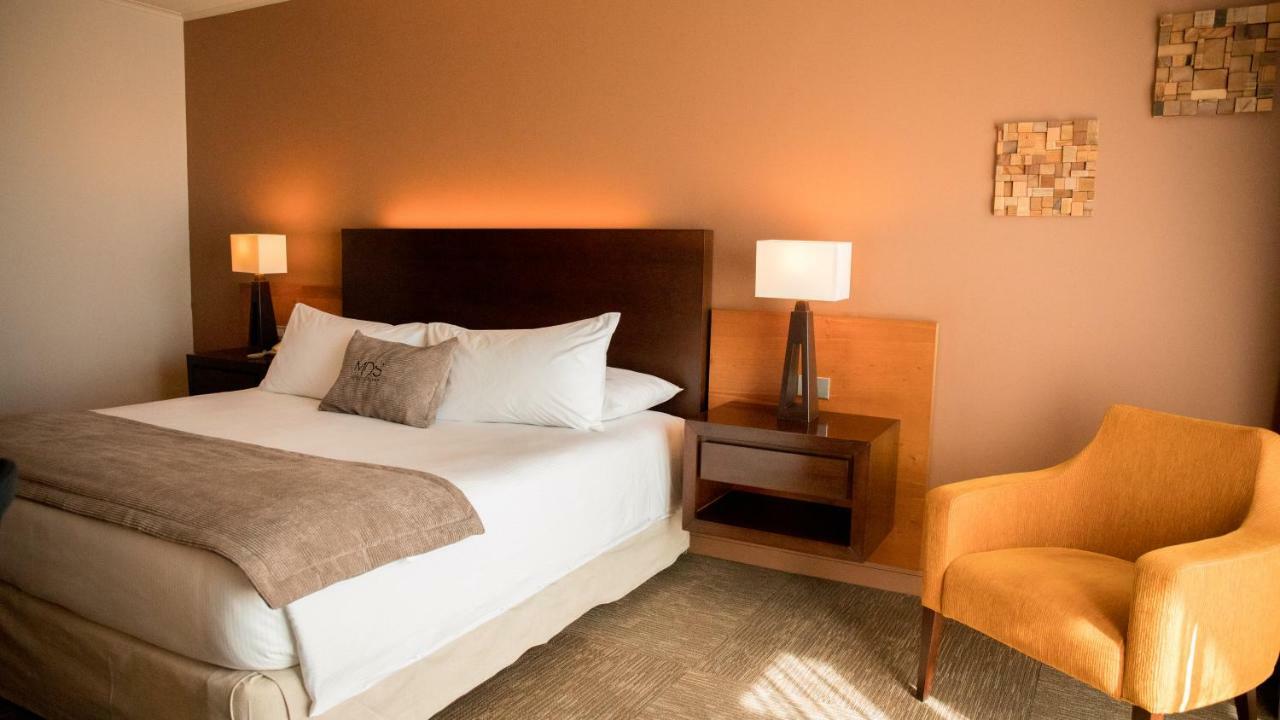 Mds Hotel Calama Bagian luar foto A bedroom at the hotel