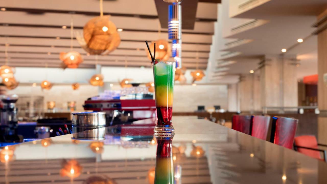 Mds Hotel Calama Bagian luar foto A layered cocktail